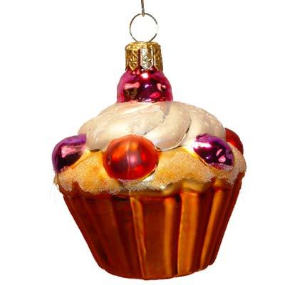 The Cupcake Christmas Ornament from Varsovia of Poland features shiny red, gold, and purple decorations, white frosting, and a gold loop for hanging.
