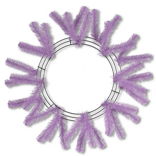 The 24 Work Wreath Lavender XX748813 features a circular wire frame adorned with lavender-colored faux pine branches. These branches are evenly distributed, creating an ideal base for adding mesh netting or seasonal decorations.