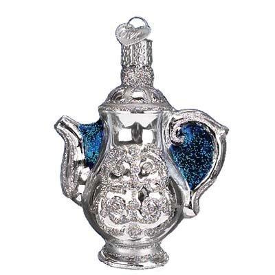 The Coffee Pot 32174 Old World Christmas Ornament features detailed silver glass with blue glitter on the handle and spout, plus a hanging loop—perfect for adding classic charm to your holiday décor.