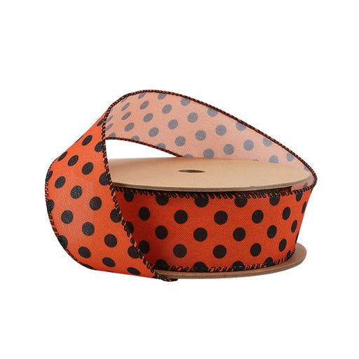The 1.5" Orange and Black Polka Dot Faux Linen Ribbon (4115W-750-38E) features orange fabric with black polka dots, a black outlined edge, and a textured faux linen finish, shown partially unwound against a white background.