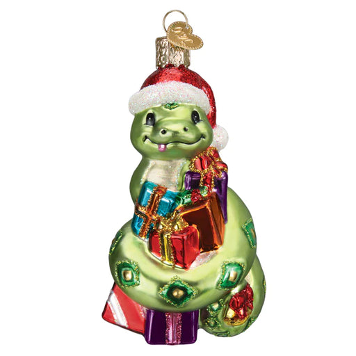Presenting the Santa Snake Ornament from Old World Christmas, model 12682, an ideal choice for reptile enthusiasts this holiday season. This glass ornament showcases a cheerful green snake in a red Santa hat, wrapped around vibrant presents. Adorned with shiny details and finished with a gold cap for hanging, it promises to enhance your festive decorations.