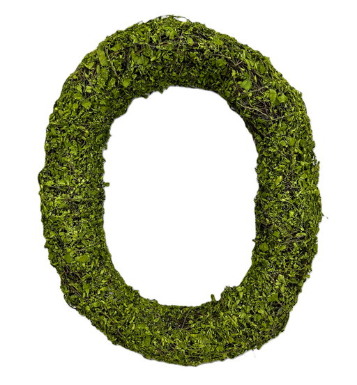 The H18xW15 Green Moss Oval Wreath 13655GN features a textured design of green leaves and moss, creating a striking piece of natural home decor on a white background.