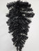 The 24 Halloween Teardrop Black 82298-BK hangs upside down against a white wall, featuring shiny black needle tinsel branches with no decorations.