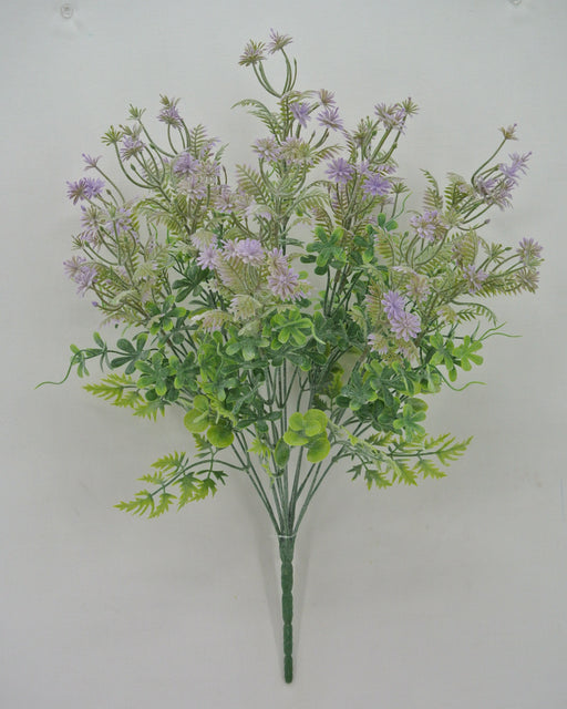 A 20 Purple Mixed Leaf Bush features 12 stems with light purple blooms, vibrant green foliage, and accents of fern-like leaves for variety and texture against a plain white backdrop.