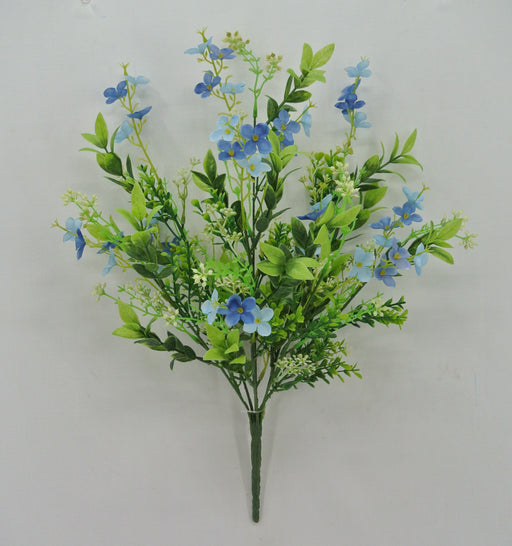 The 19 Blue Mini Flower Leaf Bush 32025-BL features clusters of blue mini flowers with green leaves and tiny white blossoms set against a light gray backdrop.