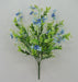 The 19 Blue Mini Flower Leaf Bush 32025-BL features clusters of blue mini flowers with green leaves and tiny white blossoms set against a light gray backdrop.