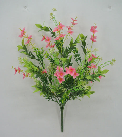 The 19 Pink Mini Flower Leaf Bush 32025-PK showcases a fan-shaped bouquet of pink mini flowers, their vibrant petals with yellow centers beautifully balanced by lush green leaves and stems, all set against a plain light background.