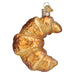 The Croissant Ornament by Old World Christmas (32621) is a hand-blown glass decoration shaped and painted like a golden brown pastry, with a metal cap and loop—perfect for adding French flair to your holiday décor.