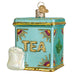 The Tea Tin Old World Christmas Ornament 32654 combines a vintage teal design with gold trim and colorful accents. TEA shines in gold letters, and a glittering white tea bag hangs on the side, adding charm.