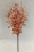 The 21 Fall Birch Berry Spray 40373 is an artificial branch with reddish-orange leaves and orange berry clusters, perfect for adding a touch of autumn color to any space with a plain, light background.
