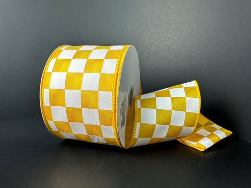 The 2.5X10Y Yellow Satin/White Racechex Ribbon features a yellow and white checkered pattern on a dark background, with its intricate motif elegantly revealed.