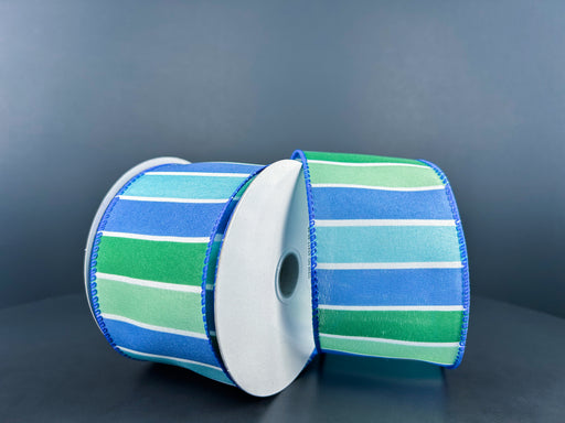 Two spools of 2.5X10Y White Satin/Blue-Green Seaside Wide Stripes Ribbon are displayed side by side against a dark background, showcasing horizontal bands in shades of blue and green.