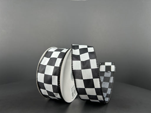 Two rolls of 1.5X10Y Black Satin/White Race Checks Ribbon (42437-09-21) are against a gray background: one upright, the other partially unrolled to display its black and white checkered pattern.