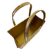 A 10 x 8 x 4 Antique Gold Distressed Metal Tote Bag (570505) with two curved handles, shiny finish, and open top is photographed from above on a white background.