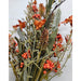A close-up of the 24 Orange Lavender Berry Spray 63048-OR highlights artificial green leaves, orange lavender berries, brown pinecones, and orange flowers beautifully arranged against a light background.