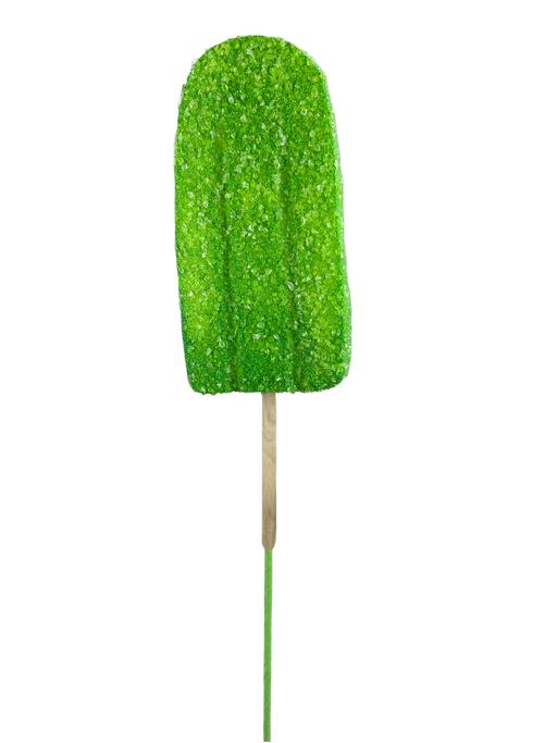A 20" by 4" Green Popsicle Pick, model 63396GN, with its sugary coating and wooden stick, is displayed against a plain white background, emphasizing its refreshing allure.
