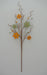 The 28 Green Wooden Daisy Spray, SKU 63846, features a metal design with brown branches, curly tendrils, orange and green flowers resembling button-like wooden daisies, and small green beads for an eye-catching display.
