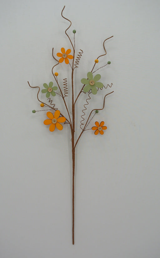 The 28 Green Wooden Daisy Spray, SKU 63846, features a metal design with brown branches, curly tendrils, orange and green flowers resembling button-like wooden daisies, and small green beads for an eye-catching display.