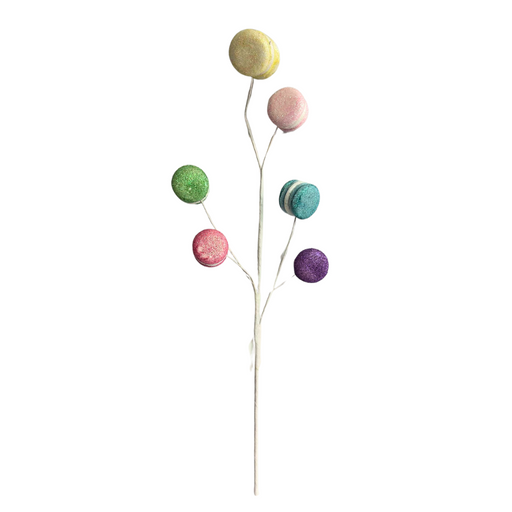 The 25" Macaroon Spray 64514 features a white branch adorned with decorative, glittery macaroon-shaped ornaments in pastel shades of yellow, mint, pink, green, blue, orange, and purple.