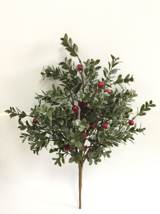 The 21 Red and Green Iced Boxwood Berry Spray 65382 features green leaves, red berries, and artificial snow, set against a plain white background.