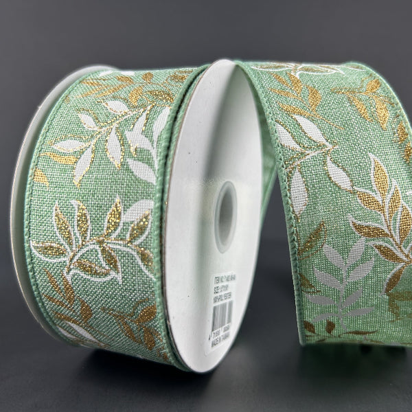 The 1.5X10Y Mint Linen/White-Gold Pressed Branches Ribbon (71492-09-06) features a mint, white, and gold pressed branches pattern. Highlighted on a dark gray background, the linen ribbon is partially unrolled to show its design.