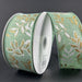 The 1.5X10Y Mint Linen/White-Gold Pressed Branches Ribbon (71492-09-06) features a mint, white, and gold pressed branches pattern. Highlighted on a dark gray background, the linen ribbon is partially unrolled to show its design.