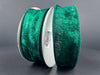 Two spools of Hunter Lush Velvet ribbon, 1.5 inches wide and 10 yards long, stand upright against a gray background. The ribbon features a soft texture and a rich emerald color, reminiscent of the wired ribbons often used for delicate crafts. One spool displays a white label with the product code "72430-09-07" in black text.