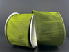 A close-up of the 2.5X10Y Moss Green Faux Dupioni Ribbon 72434-40-08 shows its wide, shiny, wired edges partially unspooled against a plain dark background.