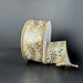A spool of 1.5X10Y Ivory Satin/Gold Embossed Vines Ribbon (73528-09-41) with a gold leaf pattern and gold edges rests against a dark background, partially unrolled and elegantly draping to the side.