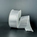 A spool of 1.5X10Y White Satin/Silver Metallic Embossed Vertical Grain Ribbon (76555-09-51) stands upright against a dark background, with a length unrolled and elegantly draped beside it.