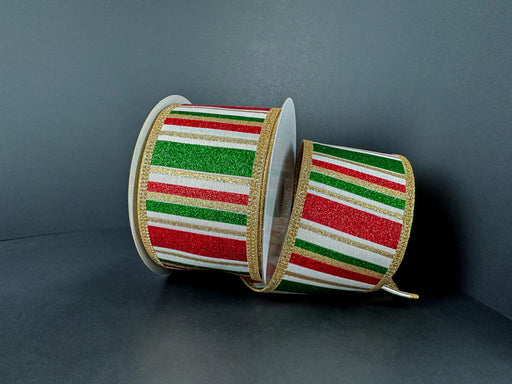Two rolls of 2.5x10Y ivory satin ribbon feature green and red glitter with gold metallic stripes, set against a plain dark background that highlights their festive design. Product: 76565-40-18.