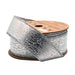 A spool of 1.5" Silver Faux Leather Ribbon (WR-10189-038-10) with a metallic texture, partially unrolled on a brown cardboard reel.