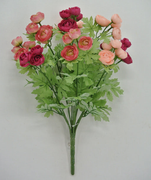 The 16 Long Pink and Fuchsia Ranunculus bush (9 stems, 84399-PKFU) features artificial ranunculus flowers with green leaves, arranged against a plain white background.