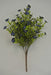 The 16 Blue Filler Bush 9 Stems 85152-BL features artificial green leaves and small dark blue flowers on brown stems, set against a plain light gray background.