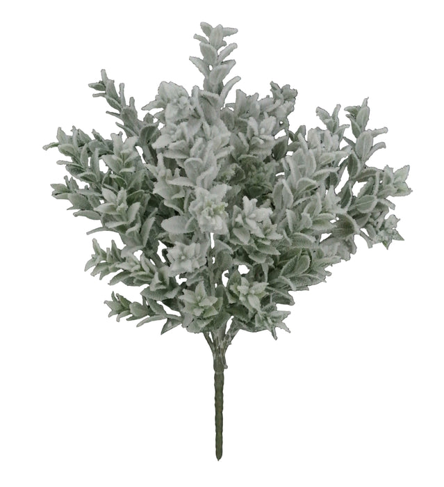 The 18" Snowed Tea Leaf Bush with 7 Stems (85286) features elegant white foliage that stands out beautifully against dark surfaces, creating a striking display of delicate charm.