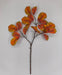The 39 Long Yellow and Orange Magnolia Leaf Spray (85320-YELOR) features broad, oval-shaped leaves in vibrant orange, yellow, and red hues, beautifully arranged against a plain white background.