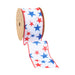 The 2.5 White with Red and Blue Stars Wired Ribbon features a star pattern on a white background with red edge stitching and is partially unraveled from a brown cardboard spool.