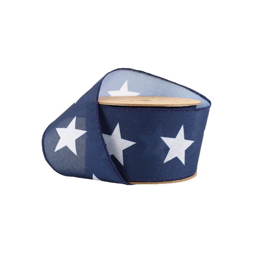 The 2.5 Blue with Large White Stars Ribbon 9506W-032-63E features a wooden core and is partially unrolled, elegantly showcasing its starry pattern, ideal for adding a whimsical touch to crafts or gift wrapping.
