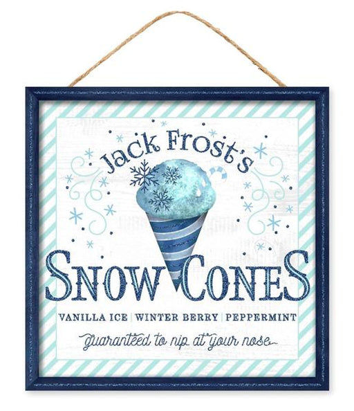 The 10" Sq White/Multi Blue Jack Frost Snow Cone Sign AP7825 is a framed MDF sign that highlights Jack Frost's Snow Cones with a blue snow cone illustration. The text, "Vanilla Ice, Winter Berry, Peppermint—Guaranteed to nip at your nose," adds a whimsical touch. It is elegantly bordered with charming light blue stripes.