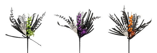 Three black botanical arrangements feature 16L assorted berry leaf picks with skeleton hands, spiders, and leaves in lime on the left, purple in the center, and orange on the right against a white background.
