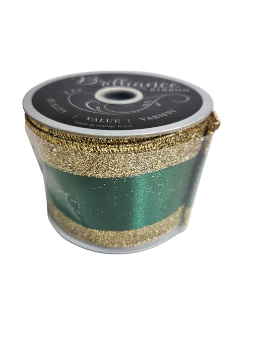 A spool of 2.5x10yd Emerald Gold Vertical Glitter Stripe Ribbon (LS31207R) labeled “Brilliance” sits on a white surface, its sparkling stripes adding elegance and shimmer to any décor.