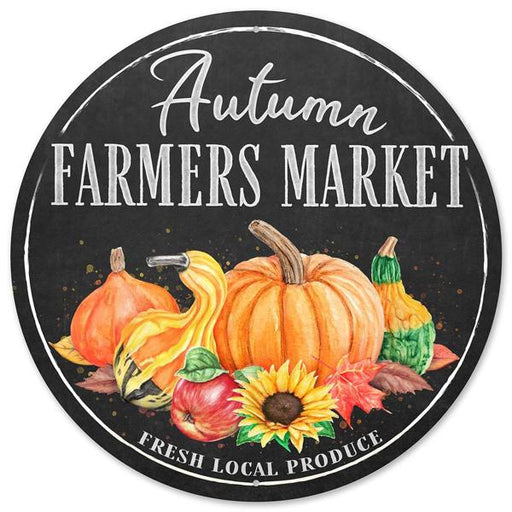 The 12Dia Metal Autumn Farmers Market Sign (Charcoal/Yellow/Green/Orange, MD0995) features Fresh Local Produce, pumpkins, gourds, leaves, and a sunflower on a black background.