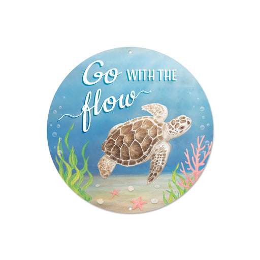 The 8Dia Metal Go With The Flow Sign Blue/Brown/White MD1386 features a sea turtle swimming near coral and seaweed on a sandy ocean floor with bubbles, and Flow Sign is etched in playful white font against the blue, brown, and white background.