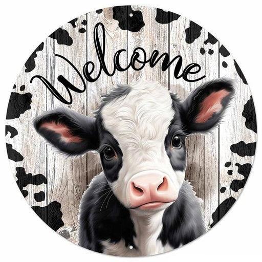 The 12DIA Black White Lt Natural Metal Welcome W/Calf Sign (MD151902) features a cute calf on a rustic wood-look background with cow spots and Welcome in bold script—ideal charming decor for any space.