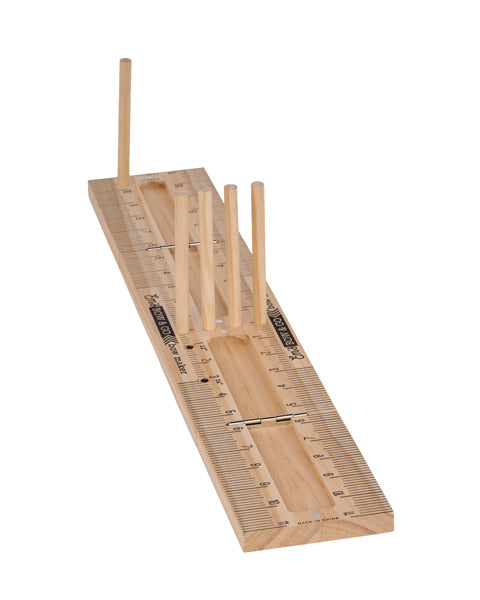 The 22L Natural EmS Bow & Go Bowmaker MT1087 features a flat, ruler-style base with upright dowels of varying heights—perfect for measuring and shaping socks during knitting.