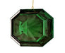 The 6" Acrylic Square Precious Gem Ornament Emerald MTX67415 features a faceted, emerald-green, octagonal design hanging from a thin gold string against a white background.