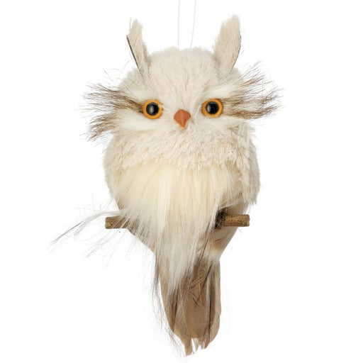 The 7 Natural and Cream Flat Natural Snow Owl Ornament (MTX71197) features fluffy white plumage, large yellow eyes, brown-tipped feathers, and sits on a small wooden perch against a plain background.