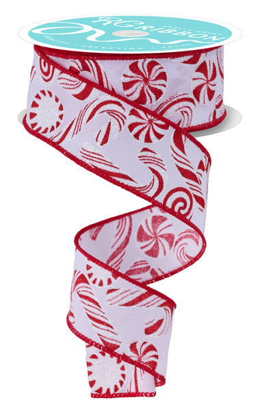 The 1.5 X10Yd White/Red Glitter Candy/Candy Cane Ribbon RGF180427 features red peppermint candies and candy canes, plus glitter accents along the red edges, unrolling in a spiral shape.