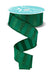 A 1.5 x 10 yd spool of emerald green ribbon (RGF196606) with horizontal glitter stripes and matte accents, partially unrolled and curling down; the spool’s white top features printed text.