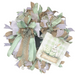 The Sage Easter Bunny Completed Wreath features green, white, and burlap ribbons, a large bow, and a sign with a white bunny and green Easter eggs on plaid. Shipping is included for your convenience!.